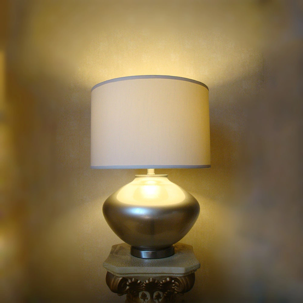 Metal Lamp Body in Champagne Finish and White Fabric Lamp Shade Table Lamp.