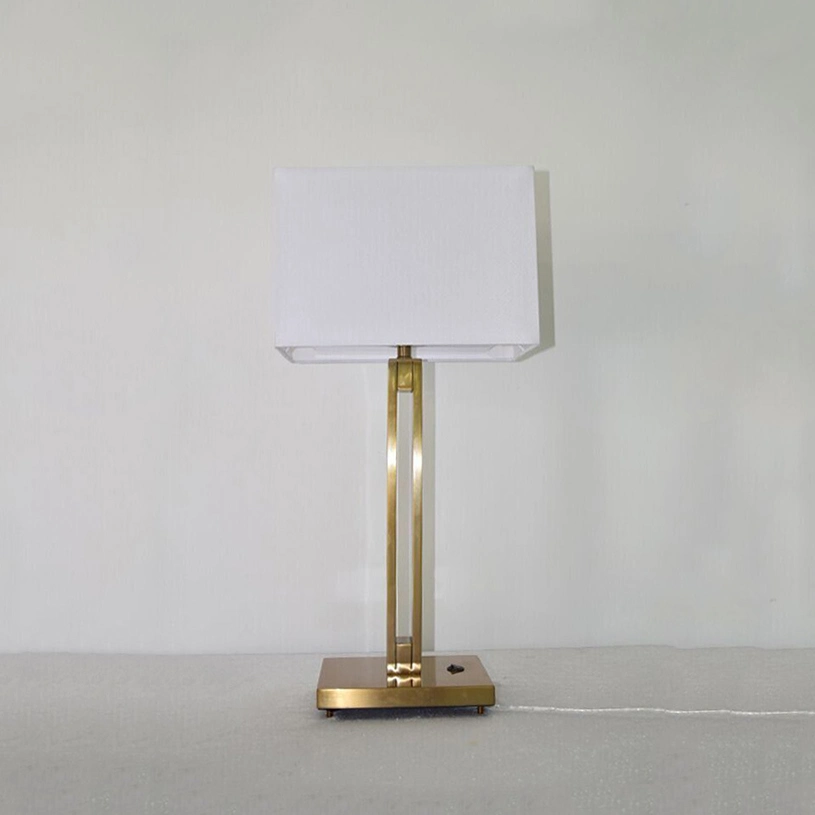 Metal Lamp Body in Brass Finish and White Fabric Lamp Shade Table Lamp.