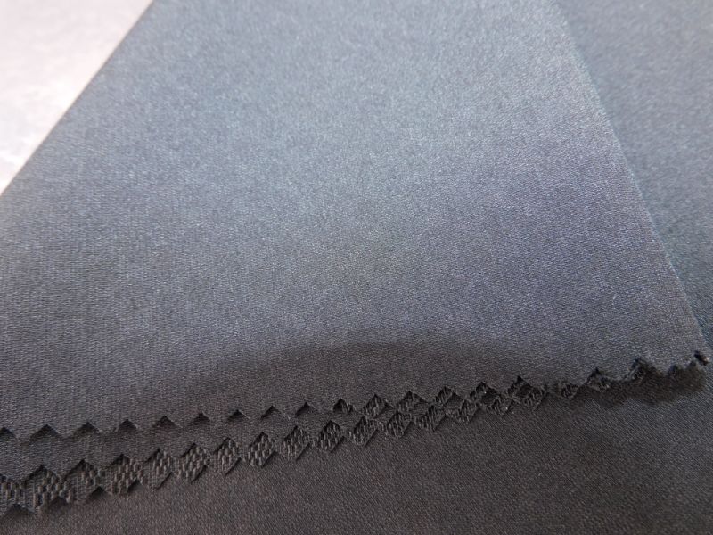 a Solid Black Fabric with a Raised Surface