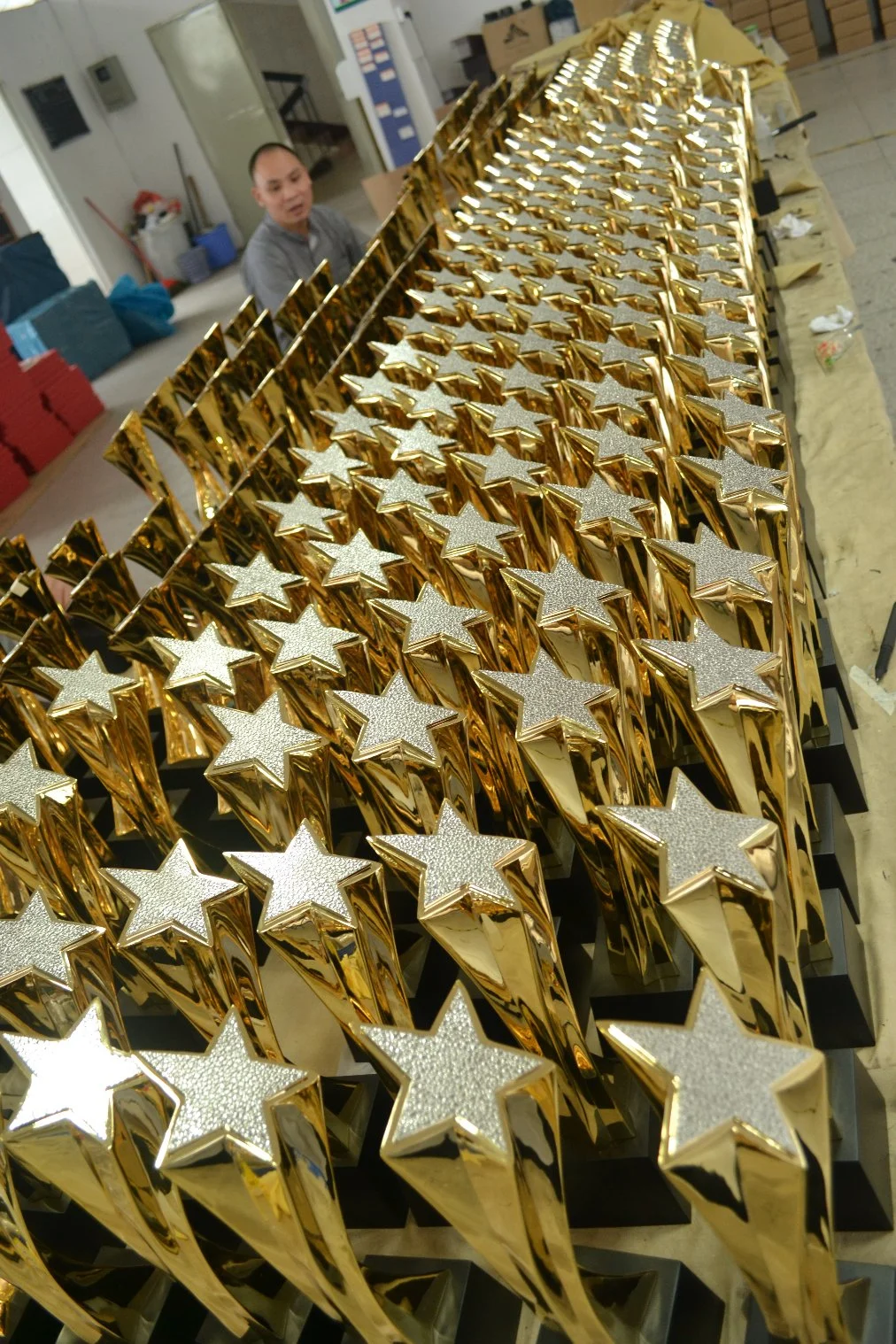 Our Gleaming Gold Plated Award Raises a Star High Above Its Head to Honor The Mastery