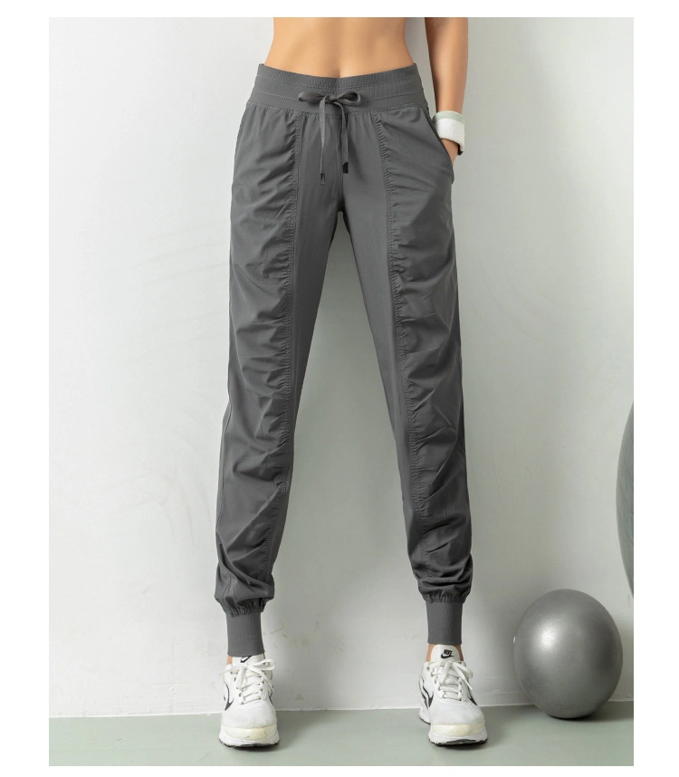 Customized Ruched Sports Windbreaker Cropped Trousers Women Tapered Yoga Track Stack Jogger Pants with Draw String